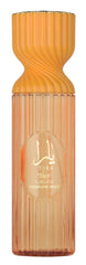 Lattafa Yara Tous perfume mist bottle shows tropical fruit notes for everyday freshness.