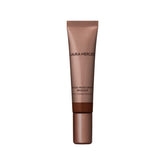 Laura Mercier Tinted Moisturizer Bronzer Sunspell application for a natural sunkissed glow.