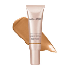 Laura Mercier Tinted Moisturizer Light Revealer with pearls for a natural glow.