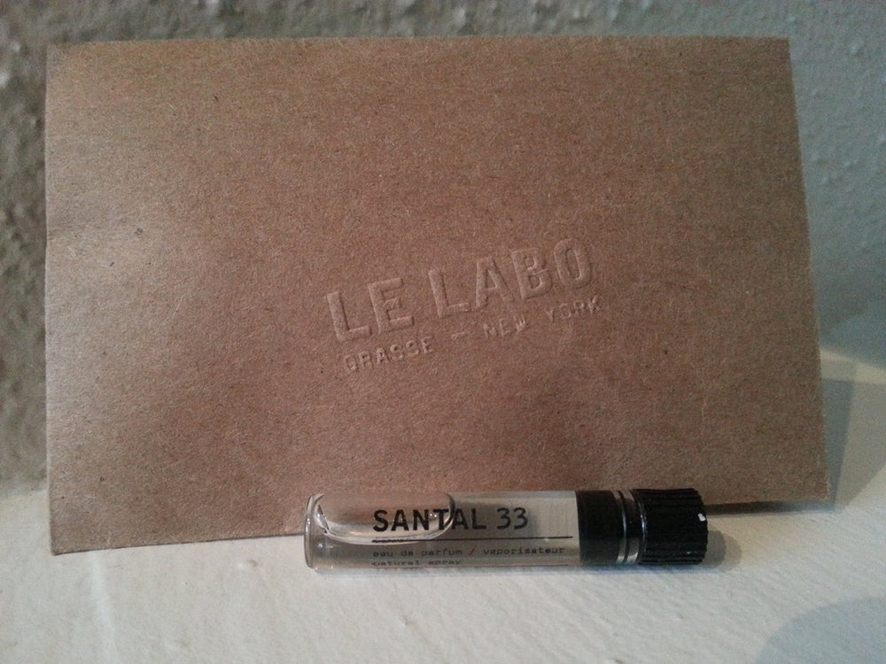 Le Labo Santal 33 sample bottle close-up for on-the-go testing.