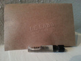 Le Labo Santal 33 sample bottle close-up for on-the-go testing.