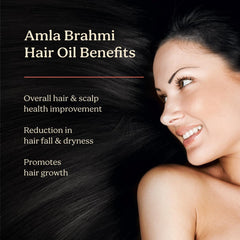 Life & Pursuits Amla Brahmi Oil ingredients closeup highlighting coconut triphala gotu kola