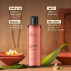Life and Pursuits Ayurvedic ingredients display including rosemary, amla, hibiscus for hair care.