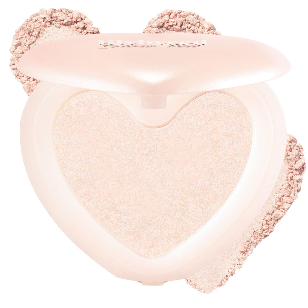 Lilybyred Luv Beam Glow Veil heart-shaped highlight on cheeks for radiant definition.