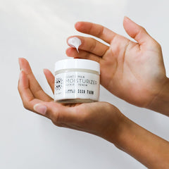 Little Seed Farm goats milk face moisturizer on hand shows fast absorption and a non-greasy finish.