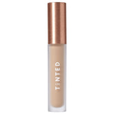 Live Tinted Hueskin Serum Concealer bottle close-up showing smooth, buildable coverage.