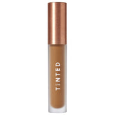 Live Tinted Hueskin Serum Concealer bottle close-up showing buildable coverage for dark circles