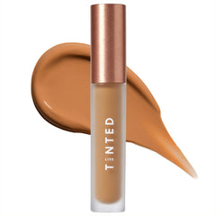 Live Tinted Hueskin Serum Concealer wand dispensing creamy formula for precise coverage.