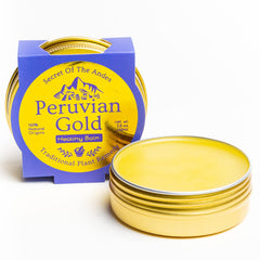 Llama Mama Peruvian Gold balm bottle closeup shows organic ingredients for skin care.