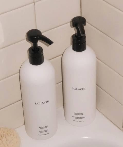 LolaVie Mega Restorative Shampoo and Conditioner bottle boosts hydration and strength.