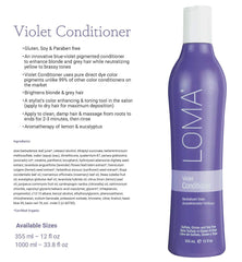 Loma Violet Conditioner being massaged into damp hair for brightening.