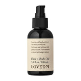 Loved01 Face & Body Oil bottle pours for daily hydration and glow.
