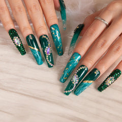 Emerald Envy Blue design highlights sparkling crystals for a statement manicure.