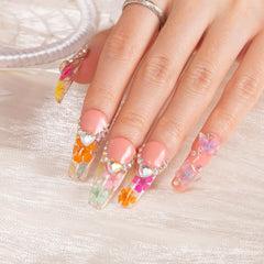 LOVFUL Flora hand wearing glossy press-on nails with crystals
