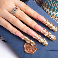 LOVFUL Gold Bling nails on hand showcasing premium salon-like finish.