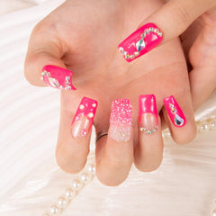 LOVFUL Pink Typhoon square 1in nails on hand demonstrate fast, thoughtful application.