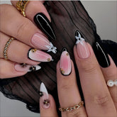 LPOODDNU black-white almond press-on nails with flower and gold beads for chic French style.