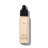 LUMINESS Air Silk 4-in-1 bottle pour showing smooth, controlled application for satin finish.