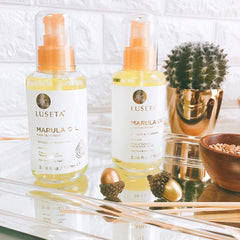 Luseta Marula Oil Hair Treatment being dispensed highlights easy application and quick styling.