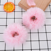 Lusofie pink pompom hair tie closeup showing soft faux rabbit fur texture