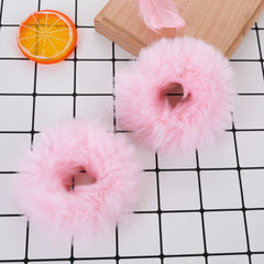 Lusofie pink pompom hair tie closeup showing soft faux rabbit fur texture