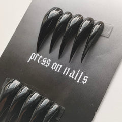 MABKJLF eagle-claw nails on hand with glossy black finish for home manicure