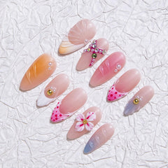 MABKJLF nails with rhinestones and petals for eye-catching party-ready style.