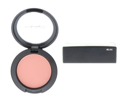 MAC Melba blush application on cheeks for subtle fade-in color.
