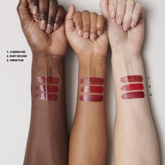 MAC Mini Lustreglass Ruby Rouge lipstick delivers sheer red glow.