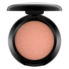 Sunbasque glow on cheeks highlights natural warmth and a healthy look.