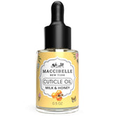 Maccibelle Cuticle Oil bottle with milk and honey scent nourishes dry cuticles.