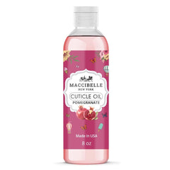 Maccibelle cuticle oil bottle applying on nails with pomegranate scent
