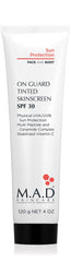 M.A.D Skincare On Guard tinted skinscreen bottle delivers lightweight sun protection with hydration.