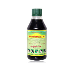 Mahabhringaraj Oil bottle pour supports night-time scalp massage for nourishment