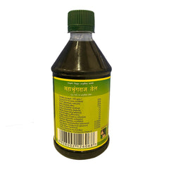 Mahabhringaraj Oil on hair for nourishing treatment and natural shine.