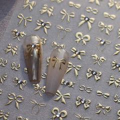 Maigitur 5D embossed gold bow nail stickers with rhinestones for a luxurious spring manicure