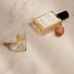 Maison Louis Marie No.04 Bois de Balincourt roll-on on skin for pulse-point fragrance release.