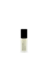 Maison Louis Marie No.04 Bois de Balincourt roll-on bottle highlighting warm woody scent.