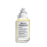 Maison Margiela Replica Afternoon Delight bottle closeup showing warm vanilla notes for cozy evenings.
