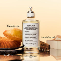 Maison Margiela Replica By the Fireplace bottle close-up suggests cozy warmth.