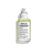 Maison Margiela Replica From the Garden bottle in sunlight evokes fresh daytime wear.
