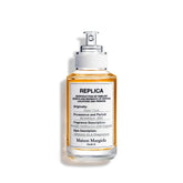 Maison Margiela Replica Jazz Club bottle on bar counter, warm evenings suggested.