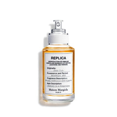 Maison Margiela Replica Jazz Club bottle on bar counter, warm evenings suggested.