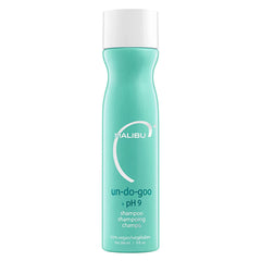 Malibu C Un-Do-Goo bottle pour demonstrates easy resin removal for refreshed hair.