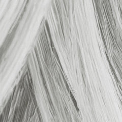 MANE Thickening fibers applied via brush for quick root coverage.