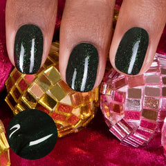 Close-up of the Green Poison brush applying glitter polish for smooth coverage.