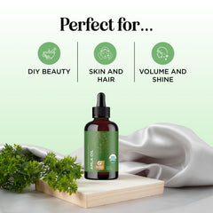 Maple Holistics Amla Oil label closeup highlights organic, pure formula for hair.