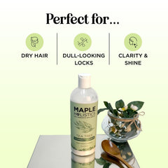 Maple Holistics Tea Tree Conditioner label close-up highlights natural oils for scalp care.