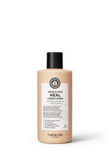 Maria Nila Head & Hair Heal conditioner bottle signaling soothing scalp support.