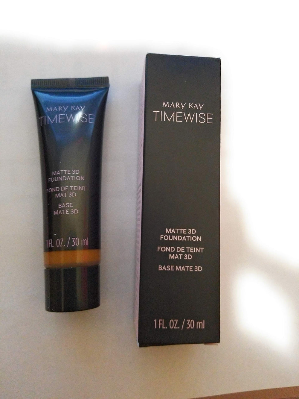 Mary Kay TimeWise Matte-Wear 3D Foundation Bronze W 140 bottle close-up, weightless matte finish for oil control